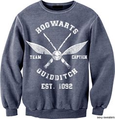 a harry potter sweatshirt with two crossed swords and the words hogwart's team