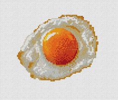 an egg is shown in the middle of a cross - stitch pattern on a white background