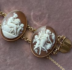 An opulent cameo bracelet containing five individually carved shell scenes and winsomely inscribed “HKH” initial on the clasp. Pieces comprising of multiple cameos, such as this example, were often commissioned by the original owner who would select them from a batch of scenes to be compiled into the jewel of their choosing. Each signet round is individually hallmarked for 14ct, indicating these scenes were initially crafted separately! It may have actually been possible to see these pieces as b Luxury Intaglio Bracelets For Gifts, Elegant Gold Cameo Bracelets, Vintage Intaglio Bracelets For Formal Occasions, Luxury Carved Bracelets For Formal Occasions, Antique Oval Cameo Bracelet, Antique Cameo Bracelet For Wedding, Formal Oval Intaglio Bracelet, Oval Cameo Bracelet For Formal Occasions, Antique Intaglio Bracelets As A Gift