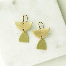 Semicircle Dangle Earrings, Brass Teardrop Earrings, Brass Half Circle Earrings, Gold Minimalist Earrings, Gold Tribal Earrings, Geometric A pair of small geometric style earrings made from natural, golden brass that has been sealed to protect the finish. Simple, trending style and a lightweight pair of everyday brass dangle earrings. * Drop length 1 inch * Natural brass that has been sealed * Lightweight * Unique handmade ear wires www.etsy.com/shop/heatherberry http://www.facebook.com/pages/He Matte Gold Minimalist Metal Earrings, Matte Gold Minimalist Earrings, Gold Geometric Earrings For Everyday, Modern Teardrop Brass Linear Earrings, Modern Brass Earrings For Everyday, Nickel-free Geometric Brass Earrings, Modern Everyday Brass Earrings, Minimalist Brass Earrings With Ear Wire, Minimalist Brass Drop Earrings