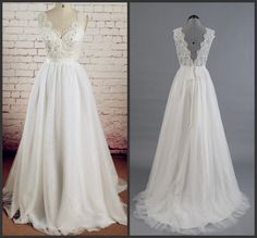 a white wedding dress on display next to a mannequin wearing a lace top and tulle skirt