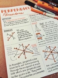 a paper with some writing on it next to two pencils and an orange marker