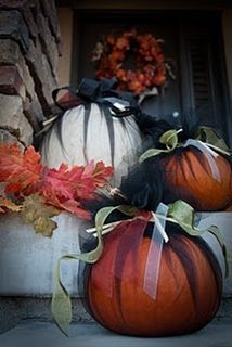 two pumpkins sitting on top of a step