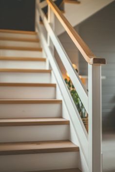 An inspiration pin showcasing charming rustic stair railing ideas for a cozy farmhouse look in home interior design. The image features a stylish wooden railing that blends rustic charm and modern decor.