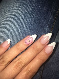 White french nail art with flower. Almond Shape White French Nails, Almond Nails French, French White Almond Nails, White French Nails, Almond Nails French, Almond Flower, Short Fake Nails, French Nail Art, Almond Shape Nails, French Tip Acrylic Nails, Almond Nails Designs