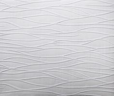 a white pillow with wavy lines on it