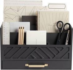 a desk organizer with office supplies in it