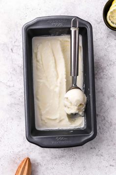 a scoop of ice cream in a pan with a spoon