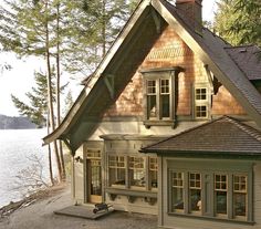 a large house sitting next to a body of water