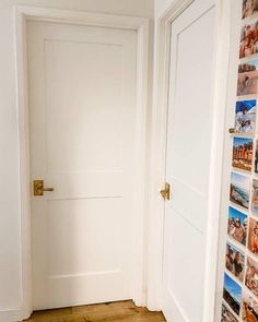 an open door leading into a room with pictures on the wall and wood flooring