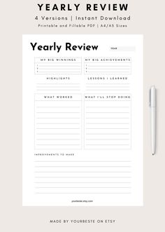 the yearly review printable is shown on top of a desk with a pen