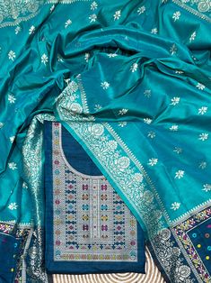 Product Details Teal Blue Unstitched Salwar Suit in kalamkari Raw Silk Elevated with Kalamkari Thread Woven Work Accompanied by an Unstitched Kurta, Bottom and Dupatta with Tassels Comes with the Vishnu Weaves Promise of Premium Quality Size & Fit Kurta & Bottom : 5.20 Mtrs Dupatta : 2.40 Mtrs Material & Care Dry Wash Only Unstitched Turquoise Salwar Kameez With Resham Embroidery, Traditional Designer Katan Silk Lawn Suit, Blue Kurta With Traditional Patterns For Ceremonies, Festive Unstitched Turquoise Salwar Kameez, Traditional Festive Katan Silk Lawn Suit, Traditional Katan Silk Lawn Suit For Festive Season, Festive Traditional Lawn Suit In Katan Silk, Traditional Silk Lawn Suit For Festivals, Unstitched Turquoise Salwar Kameez For Diwali