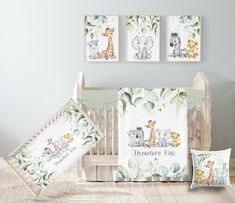 a baby crib bedding set with giraffes and elephants