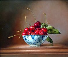 a painting of cherries in a blue and white bowl