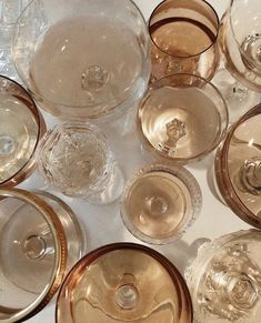 there are many empty wine glasses on the table