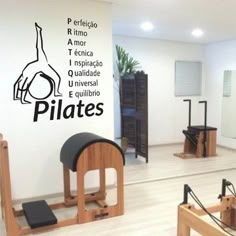 the pilates wall decal is shown in an exercise room