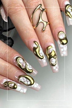 Shine bright with our collection of 50 stunning metallic nail designs! Whether you prefer short or long nails, we've curated various captivating metallic art in gold, silver, and chrome, perfect for any season. Elevate your nail game with the molten allure of Liquid Metal, adding an aesthetic touch to your look. Embrace the metallic trend and get inspired with these captivating nail designs that exude modern glamour. 💅✨ Random Nails, Metal Nail Art, Gothic Nails, Goth Nails, Y2k Nails