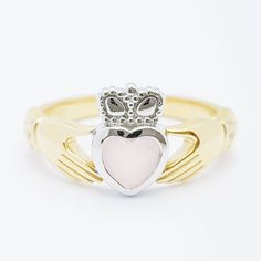 The perfect gift for yourself or someone close. Sterling silver claddagh ring set with milky pink heart shaped stone framed with white cubic zirconia in the cuffs. The hands represent friendship, the heart love and the crown stands for loyalty. This ring has been coated in a durable layer of 18k yellow gold, to maintain the color as long as possible please avoid contact with chemicals, lotions etc and keep in an airtight zip lock bag when not being worn. ----------------------------------------- Irish Claddagh Rings, Claddagh Bracelet, Silver Celtic Rings, Silver Claddagh Ring, Milky Pink, Irish Ring Claddagh, Irish Claddagh, Zip Lock Bag, Claddagh Ring