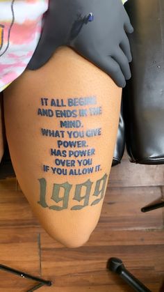 someone with a tattoo on their leg saying it all begins and ends in the mind