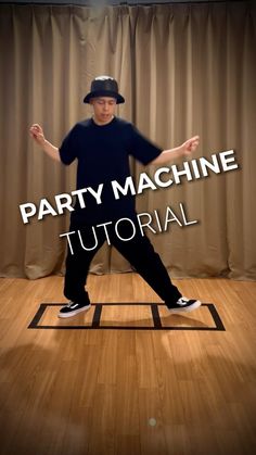 a man standing on top of a wooden floor with the words party machine in front of him