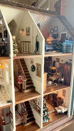 a doll house with all the furniture and accessories in it's display case is shown