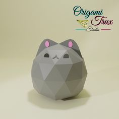 an origami hamster with pink ears and eyes on it's head