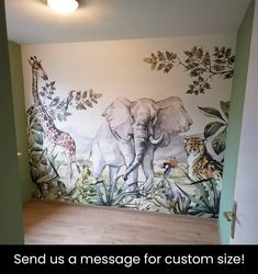 an elephant and giraffe mural on the wall in a room with wood floors