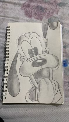 a drawing of mickey mouse on a sheet of paper