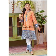 Ready to ship and wear Pakistani girls 2pc cotton party wear suit This two piece outfit features a classic combination of orange and navy blue, block printed together for a casual yet festive look. The lace touches on the sleeves and detailed embroidery on the neckline with the added blue tassle gives an elegant touch of grace and charm. Paired along with simple white cotton trousers trimmed with the matching block print design completes the look in a magestic manner. Item details: Top: Orange C Orange Long Sleeve Salwar Kameez For Eid, Casual Long Sleeve Sets For Navratri, Orange Long Sleeve Salwar Kameez For Navratri, Orange Cotton Lawn Suit For Eid, Orange Anarkali Style Cotton Kurta, Orange Long Sleeve Sets For Navratri, Orange Cotton Salwar Kameez With Straight Kurta, Orange Cotton Salwar Kameez For Navratri, Orange Cotton Anarkali Salwar Kameez