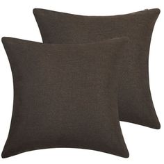 two dark brown pillows sitting next to each other