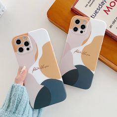 two phone cases with the same design on them, one is holding a woman's face