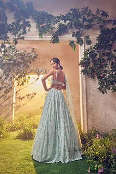 Featuring a mint green tulle lehenga embroidered fully by hand with various ornamental lustre sequences and Japanese bugle beads. It is paired with a scallop dupatta with crystal drops and blouse.From Aneesh Agarwaal's Ellora collection.DELIVERY TIMEPlease allow 8-12 weeks for your outfit to arrive.FABRIC DETAILSNetProfessional cleaning only. Green Organza Lehenga With Sequins, Elegant Pista Green Lehenga With Sequins, Elegant Pista Green Sequined Lehenga, Pista Green Sequined Anarkali Set For Wedding, Pista Green Lehenga With Sequins For Wedding, Pista Green Sequined Dupatta For Wedding, Tulle Lehenga, Scallop Dupatta, Green Tulle