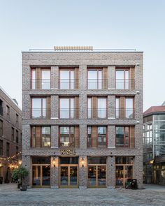 an apartment building with many windows and balconies