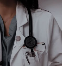 a woman wearing a white coat with a stethoscope in her pocket