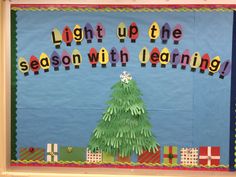 a bulletin board with the words light up the season with learning written on it and a christmas tree