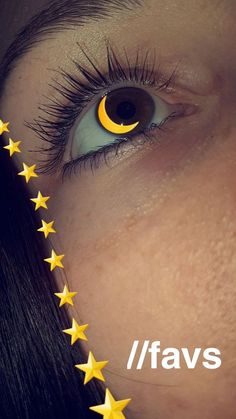 a woman's eye with yellow stars around it and the words ifavs