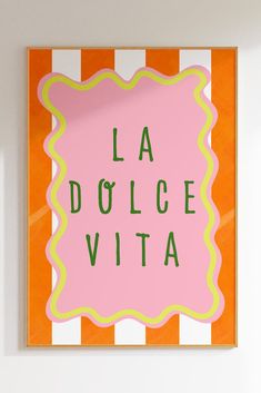 a pink and yellow sign that says la dolce vita