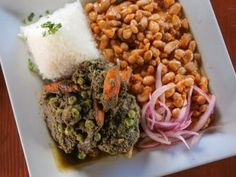 a white plate topped with beans and rice