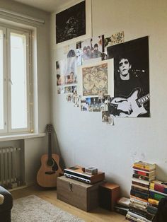 a living room filled with furniture and lots of pictures on the wall next to a window