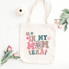 PRODUCT DESCRIPTION *  340 g/m² *  100% Cotton * EU designed and printed * Handle length: approx. 70 cm / 27,5 inch * Dimensions: 38 x 42 cm / 14,9 x 16,5 inch SHIPPING Dispatch within 1-2 working days of payment being received. DELIVERY TIME: EUROPE: 4-13 days USA, CANADA, AUSTRALIA: 9-16 days Other countries: 10-25 days TERMS 100% Exchange Guarantee - If you are unhappy with your item just email us and let us know. You are welcome to return items within 14 days of receipt. Return postage costs Beige Gift Bag For Mother's Day, Beige Rectangular Bags For Mother's Day, Mother's Day Gift Bag In Beige, In My Mom Era, Mom Gift Ideas, Mom Era, Funny Mom Gifts, Mom Funny, Cool Mom