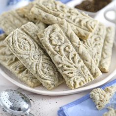 some cookies are on a plate with spoons