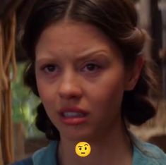 a woman with an emoticive look on her face