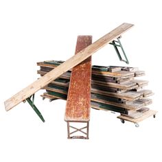 a pile of wood sitting on top of a wooden table next to a metal rack