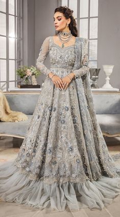 Silver Grey Lehenga Gown for Pakistani Bridal Wear is a gracefully embellished piece that gives you a magnificent appearance at your wedding. Fast Shipping Bridal Lehenga Pakistani, Grey Lehenga, One Piece Gown, Pakistani Bridal Dress, Walima Dress, Bridal Dupatta, Lehenga Gown, Pakistani Wedding Outfits, Net Lehenga