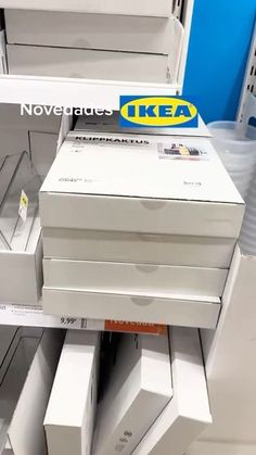 several white boxes stacked on top of each other in a store display case with the words ikea above them