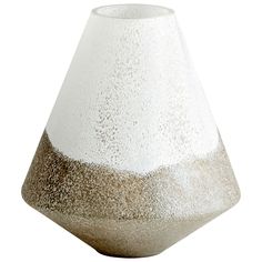 a white and grey vase sitting on top of a table