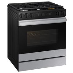 a black and silver oven with the door open on an isolated white background for use in commercial projects