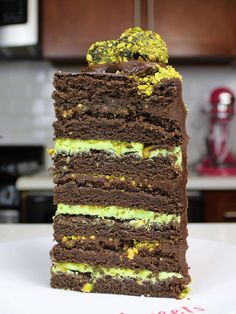 a piece of chocolate cake with green frosting