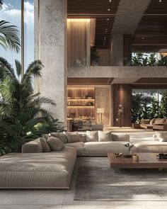 a living room filled with lots of furniture next to tall windows and palm trees in the background