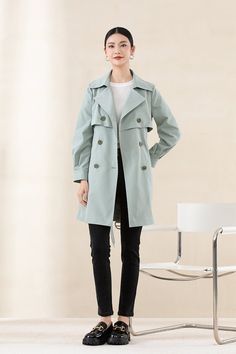 Elevate your style with our Tender Green Trench Coat, crafted from a high-quality PET fabric with a soft, cotton-like texture. This coat's low-saturation hue and classic H-line silhouette combine to offer a modern, urban chic look. Designed with sleek cuffs and a versatile mid-length, it's ideal for any height and perfect for adding elegance to your everyday ensemble. Spring Long Coat With Hidden Button Closure, Spring Pea Coat With Hidden Button Closure, Cotton Outerwear For Office In Fall, Spring Long Pea Coat With Hidden Button Closure, Double-breasted Cotton Outerwear For Work, Solid Color Lapel Collar Pea Coat For Spring, Double-breasted Spring Office Outerwear, Solid Color Pea Coat With Lapel Collar For Spring, Elegant Solid Color Cotton Outerwear